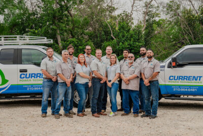 Current Power Technologies team Professional installation of a whole-house backup generator on a concrete slab, complete with natural gas lines and transfer switches, ensuring readiness for a bad storm