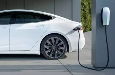 Tesla EV Charger KOHLER commercial diesel generators set up at a distribution center, designed to deliver reliable performance and regulatory compliance during outages